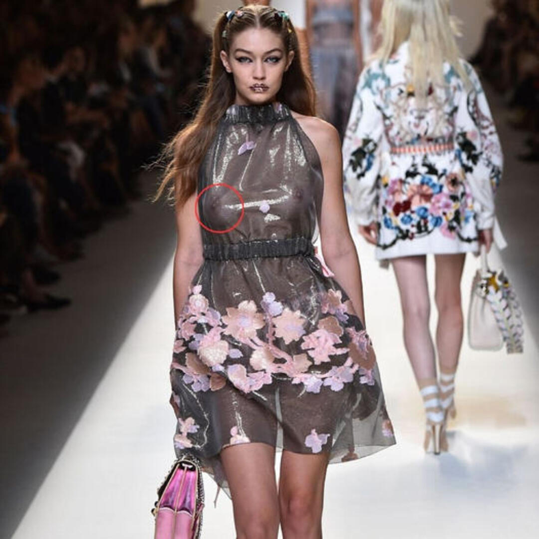 Gigi Hadid and Bella Hadid showcase Fendi’s runway in sheer floral dresses during Milan Fashion Week, with Gigi revealing her bare breasts. ‎